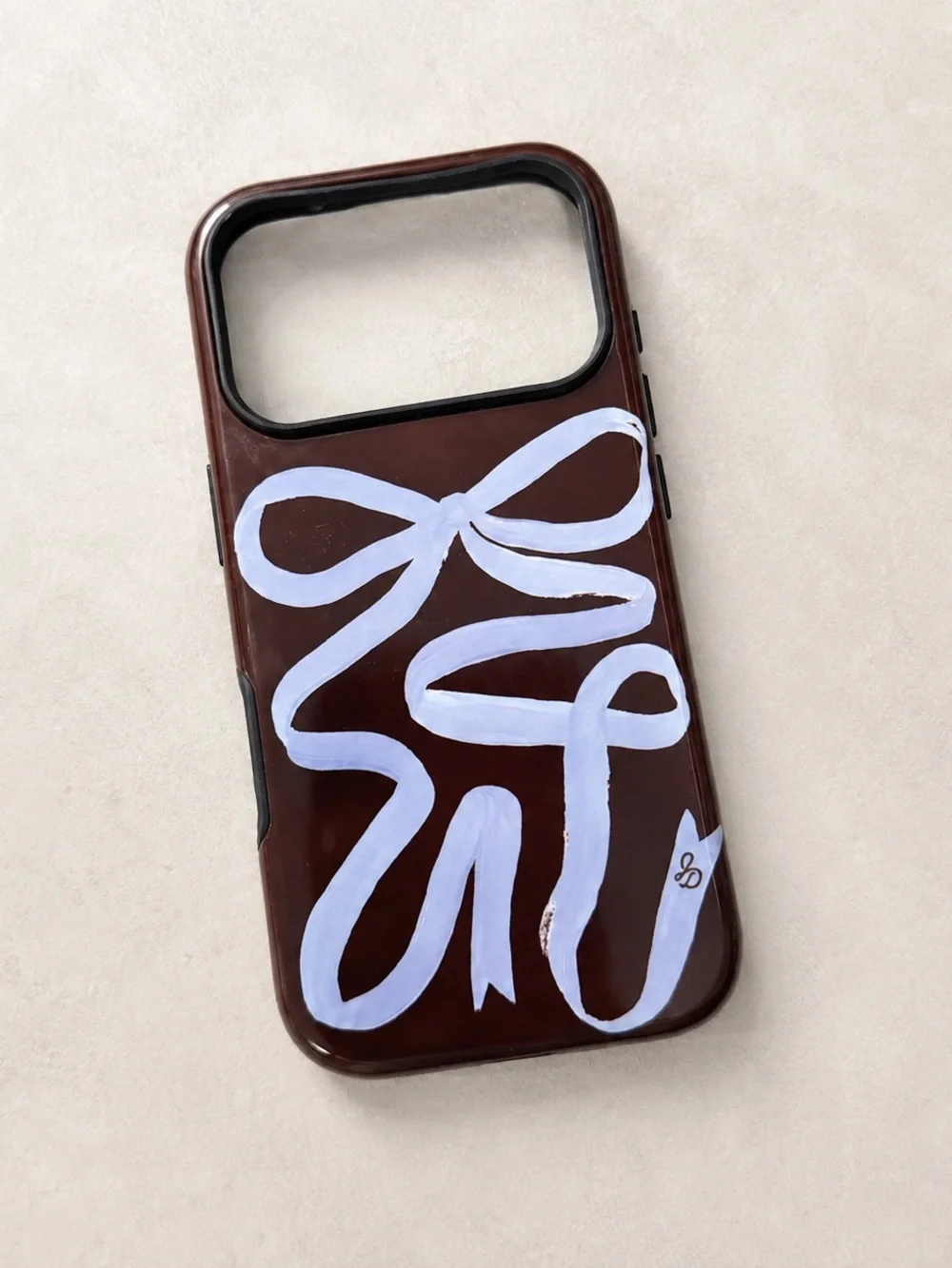 The Dairy Jasmine Dowling Mocha Ribbon iPhone 17 Pro Case
